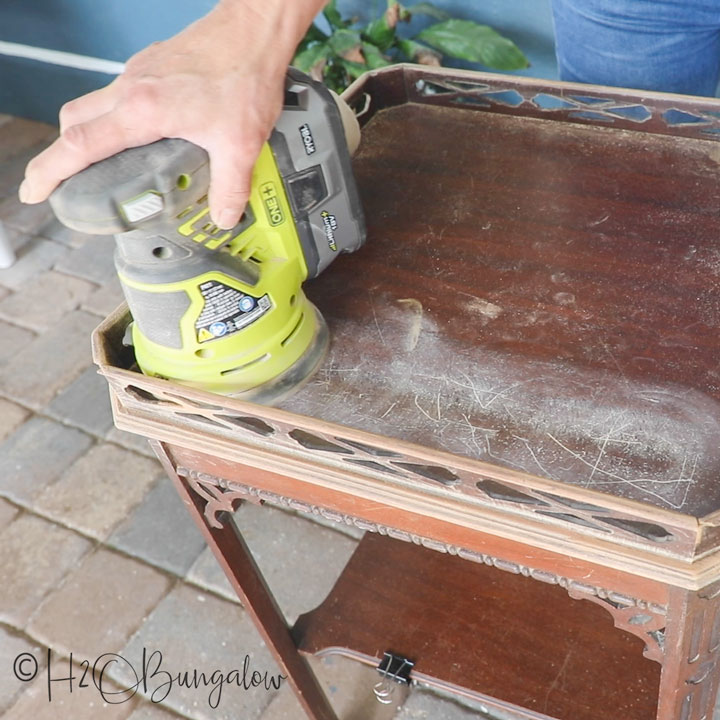 Painting over dark, wood furniture can be tough due to veneer bleeding through your fresh paint job. Follow this tutorial for tips on how to get it right!