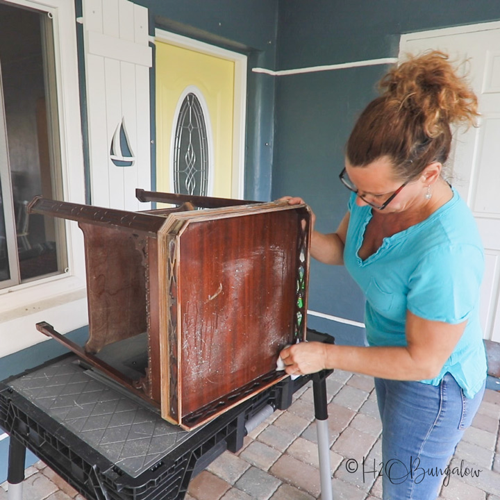 Painting over dark, wood furniture can be tough due to veneer bleeding through your fresh paint job. Follow this tutorial for tips on how to get it right!