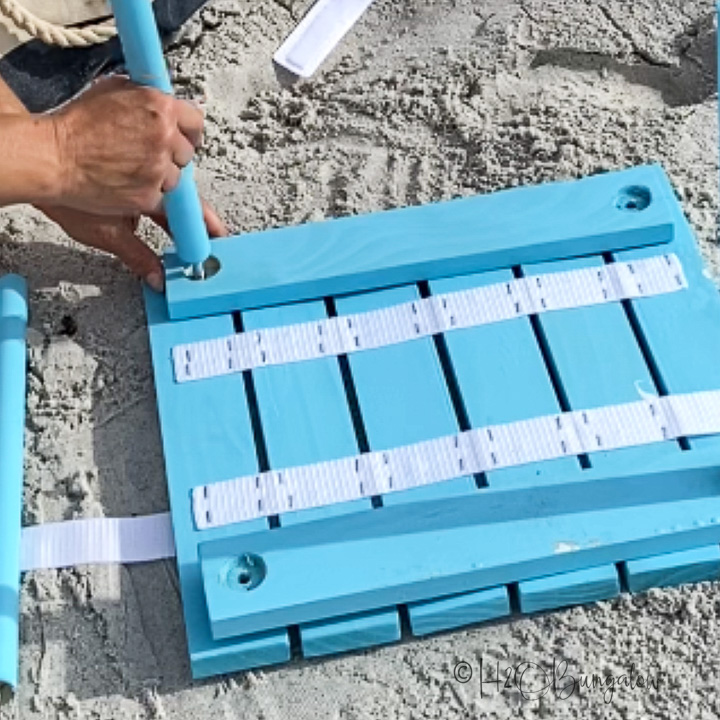 assembling portable table at beach